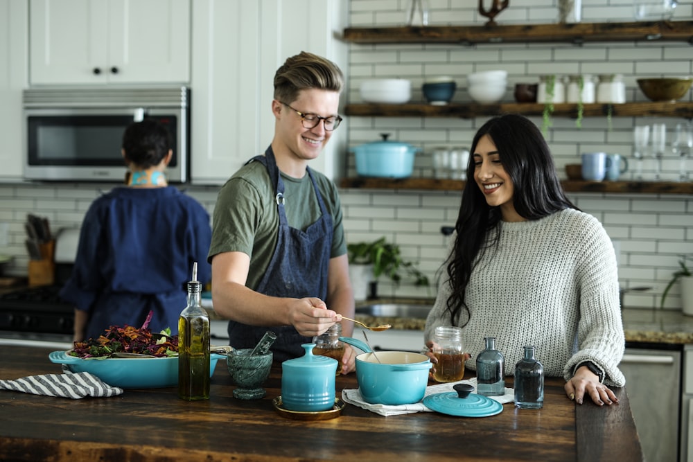 Two food creators cooking together